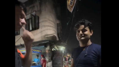 Tourist confornts the local man (X/ @ShivaSanatana1) 'Why you asking for her phone number': Foreign tourist confronts man over wife's 'harassment' in Amritsar - watch