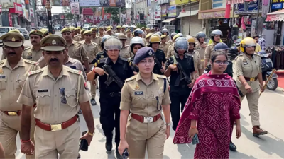 Bareilly SP South Anshika Verma leads a police flag march in the sensitive areas, in Bareilly, on Thursda. (Pic credit: PTI) Drones in air, police on streets: Security beefed up in Bareilly as four districts put on alert; internet service suspended