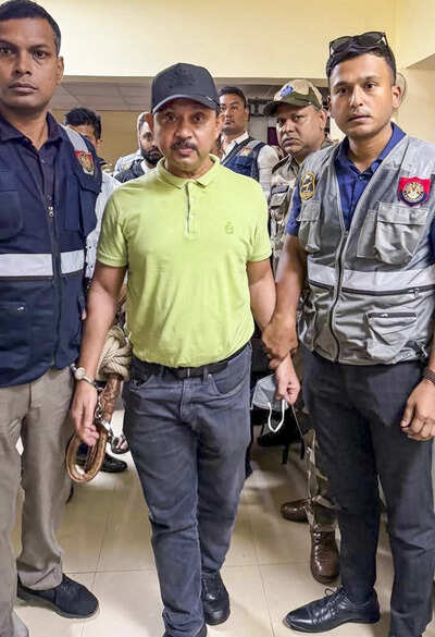 North East India Festival (NEIF) chief organiser Shyamkanu Mahanta, alleged to be involved in the death of legendary singer Zubin Garg in Singapore, is brought to the CID office following his arrest from Delhi, in Guwahti, Assam. (PTI Photo) Zubeen Garg death: ED, IT likely to join probe against festival organiser Shyamkanu Mahanta; 'financial irregularities' under scanner - report