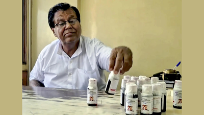 An official looks at bottles of the cough syrup after a raid by the Drug and Pharmaceuticals Department officials in Jabalpur, Madhya Pradesh. (Picture credit: PTI) Cough syrup tragedy: Madhya Pradesh bans Coldrif as kids' death toll rises to 11; test report confirms poisonous chemical