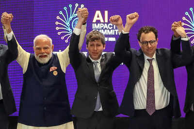Altman and Amodei, who stood side by side, did not hold hands. Instead, both raised their fists. AI misalignment: Altman vs Amodei rivalry now on stage