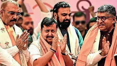 (From left) Bihar BJP chief Sanjay Saraogi, BJP national president Nitin Nabin, Bihar deputy CM Samrat Choudhary with party MP Ravi Shankar Prasad at a Holi Milan Samaroh in Patna on Tuesday BJP to contest 2 Bihar Rajya Sabha seats, Nitin Nabin to make Parliament debut