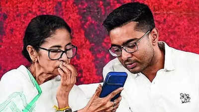 Mamata with nephew Abhishek at the protest site in Kolkata on Friday West Bengal: Didi begins sit-in, alleges EC 'plot' to delete voters' names