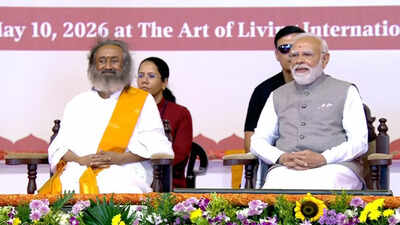 PM Modi with Sri Sri Ravi Shankar PM Modi attends Art of Living event in Bengaluru; inaugurates Dhyan Mandir, launches nationwide service initiatives