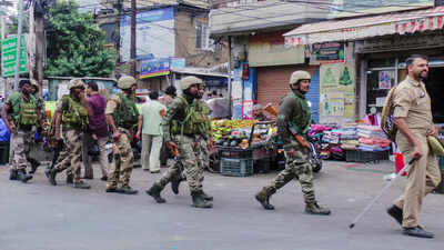 Doda: Security personnel route march following a 'Bandh' called by the Markaz-e-Seerat committee, in Doda, Jammu and Kashmir. (PTI Photo) Partial shutdown in Doda, Kishtwar over man’s death in run-in with cops
