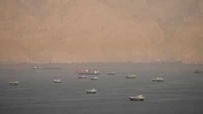 Vessels at the Strait of Hormuz, as seen from Musandam, Oman. (Reuters representative image) Gujarat-bound Qatari LNG vessel with 4 Indian crew hit in suspected drone attack near Hormuz