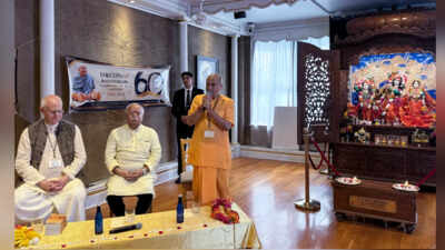RSS chief Mohan Bhagwat, second left, attends a program during his visit to the Iskcon Temple on its 60th anniversary, in New York, United States RSS chief Mohan Bhagwat visits Iskcon’s birthplace in New York, joins food distribution drive
