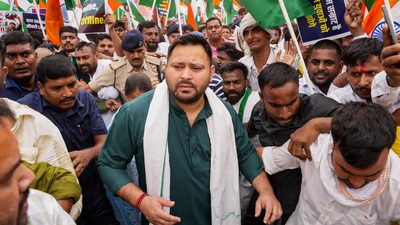 RJD leaders march to Raj Bhavan against paper leaks, job crisis; Tejashwi Yadav detained Bihar: Water cannon used as RJD leaders march to Raj Bhavan; Tejashwi Yadav detained
