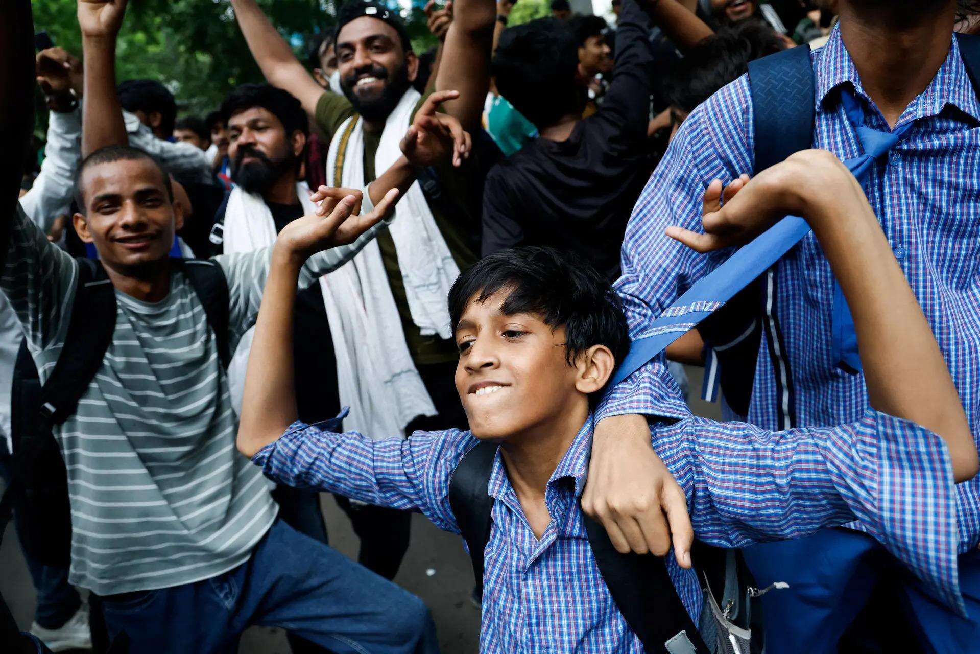Supporters of  Cockroach Janta Party (CJP) celebrate after Dharmendra Pradhan resigned<br>