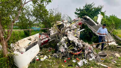 An official examines the wreckage of a Tecnam aircraft following a fatal crash in Kanpur. Garg Aviation’s trainer aircraft crashes in Kanpur, 2 killed